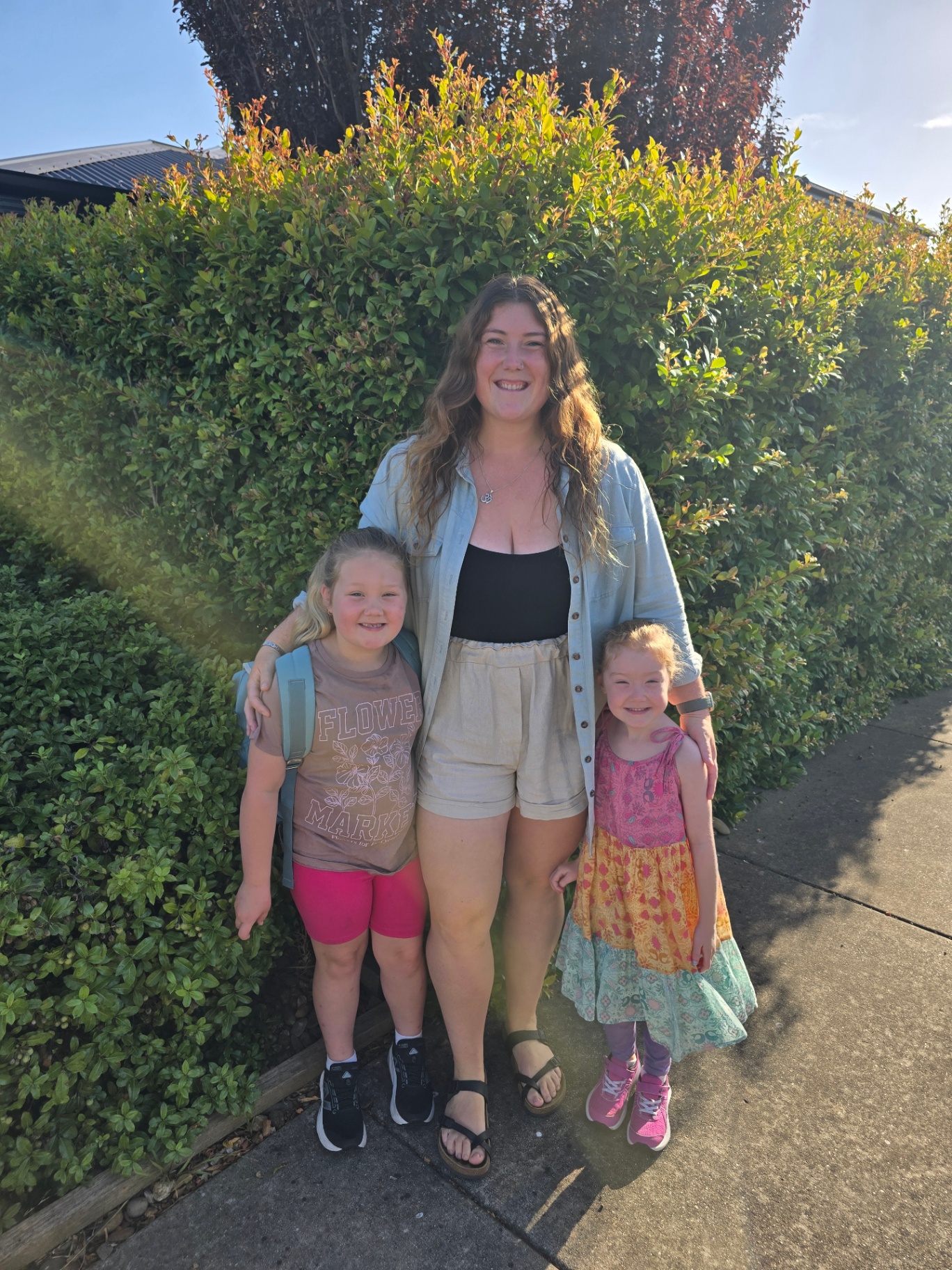 Caitie with her two daughters on a sunny morning